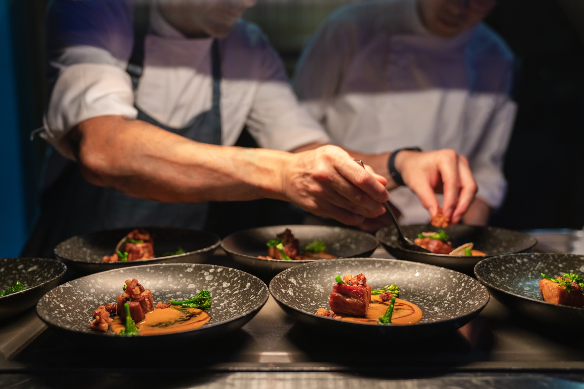 Chef plating a fine dining dish
